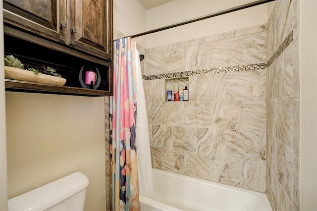 bathroom with shower / bathtub combination with curtain and toilet