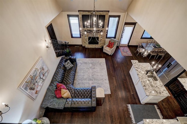 living room with a chandelier and wood finished floors