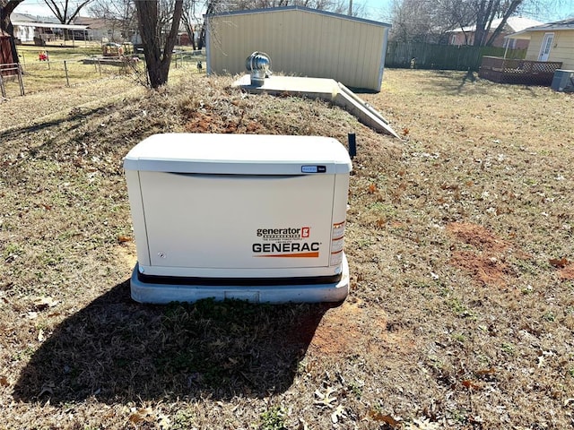 details featuring fence and a power unit