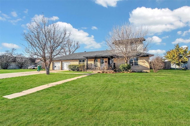 ranch-style home with covered porch, driveway, an attached garage, and a front lawn