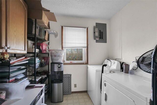 washroom featuring light floors, electric panel, cabinet space, independent washer and dryer, and a textured ceiling