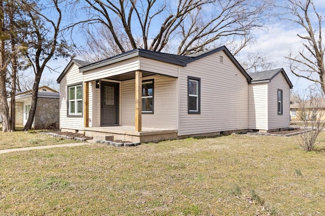 view of front facade featuring covered porch, crawl space, and a front yard