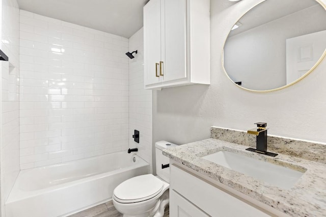 full bathroom featuring toilet,  shower combination, wood finished floors, and vanity