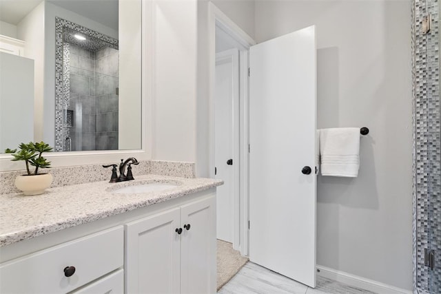 full bath featuring a stall shower and vanity