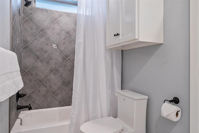 bathroom with toilet and shower / bath combination with curtain