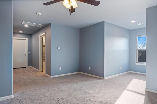 carpeted spare room with baseboards, visible vents, recessed lighting, and a ceiling fan