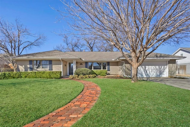 ranch-style house featuring a garage, brick siding, driveway, and a front lawn