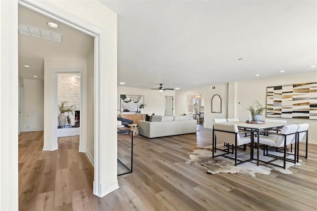 dining room featuring ceiling fan, wood finished floors, visible vents, and recessed lighting