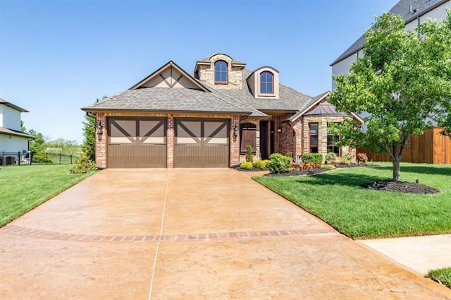 view of front of house featuring concrete driveway, fence, brick siding, and a front lawn