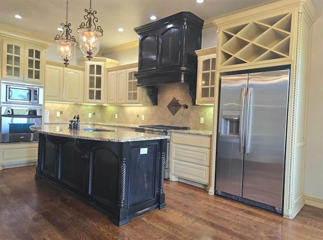 kitchen featuring dark wood-style floors, stainless steel appliances, and a sink