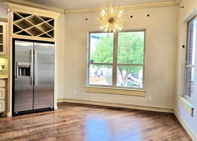 kitchen with a chandelier, wood finished floors, baseboards, ornamental molding, and stainless steel refrigerator with ice dispenser