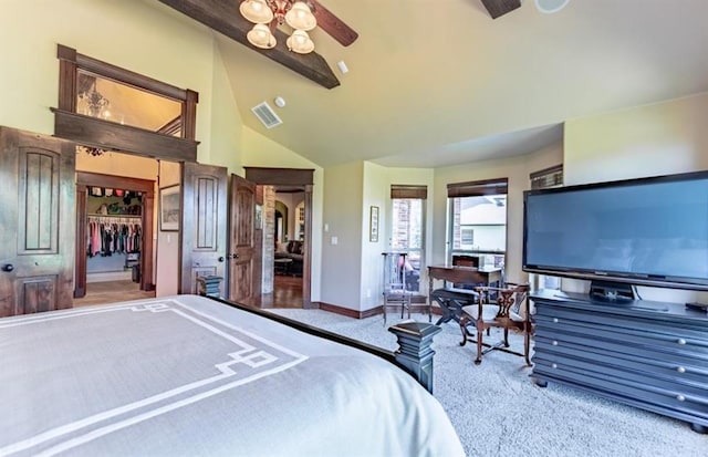 carpeted bedroom with beam ceiling, visible vents, a spacious closet, high vaulted ceiling, and baseboards