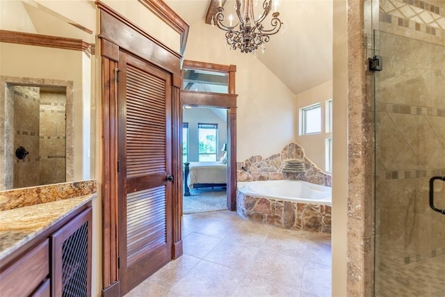 bathroom with a shower stall, vaulted ceiling, and a wealth of natural light