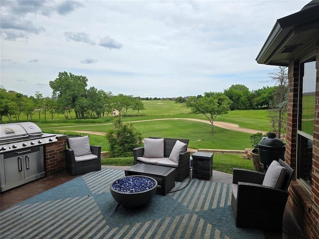 view of patio / terrace featuring view of golf course, a grill, and an outdoor living space