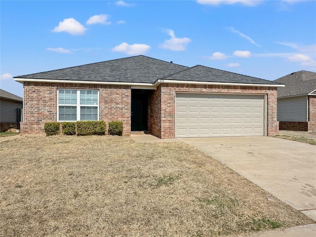 ranch-style home featuring an attached garage, roof with shingles, concrete driveway, and brick siding