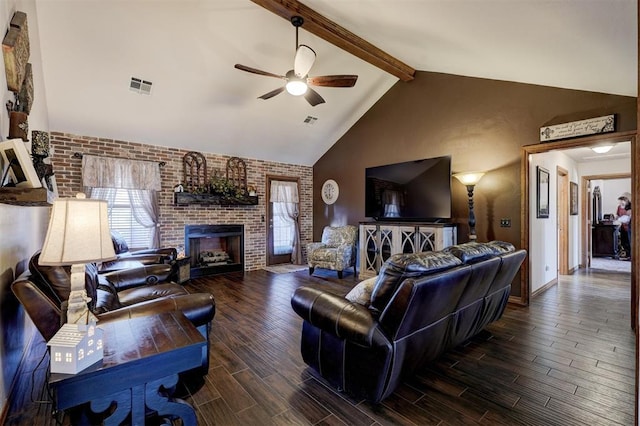 living area featuring visible vents, a ceiling fan, beamed ceiling, wood finish floors, and a healthy amount of sunlight