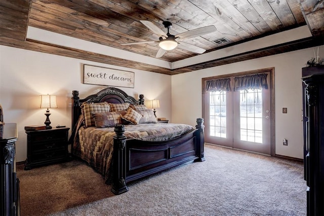 bedroom with wooden ceiling, carpet floors, baseboards, access to exterior, and a tray ceiling