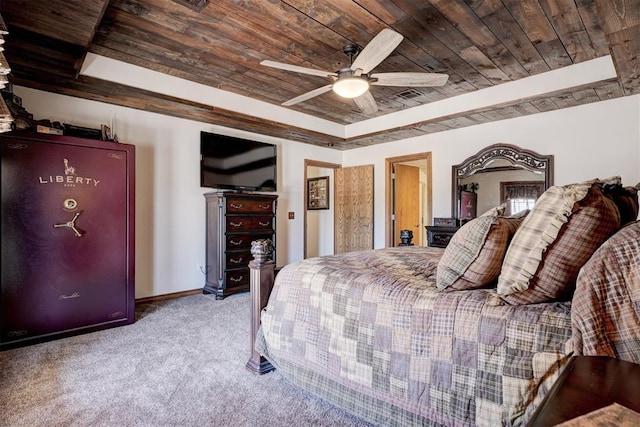 bedroom with wooden ceiling, visible vents, a ceiling fan, a tray ceiling, and carpet