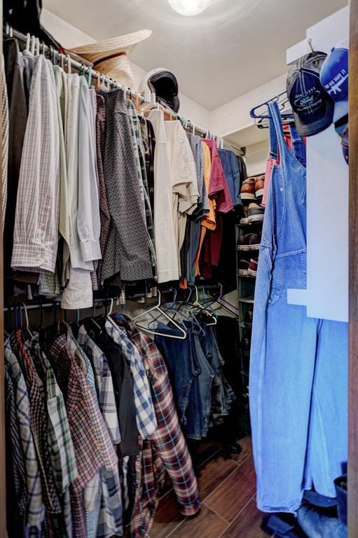 spacious closet with wood tiled floor