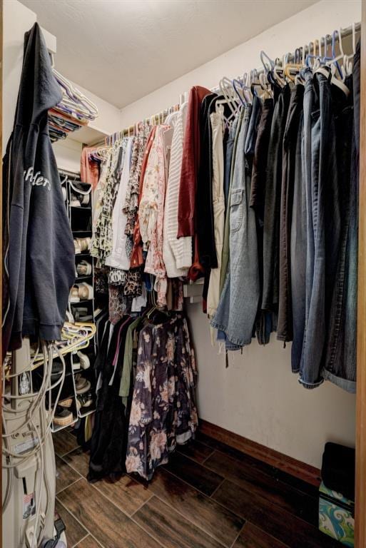 spacious closet featuring wood finish floors