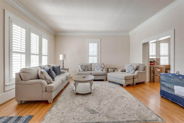 living room featuring light wood-style floors and crown molding