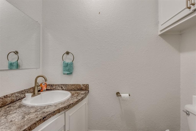 half bath with vanity and toilet