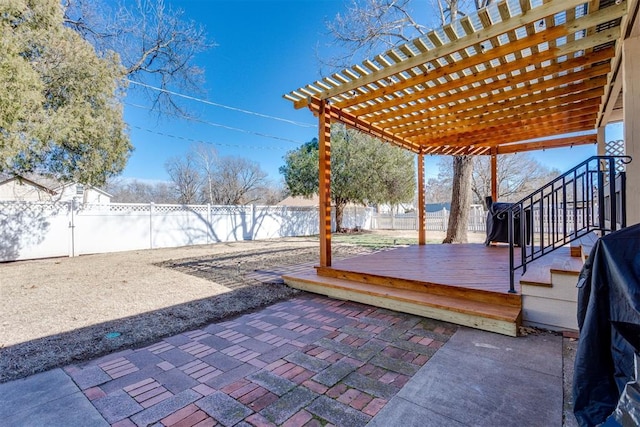 view of patio / terrace featuring a fenced backyard, a wooden deck, and a pergola