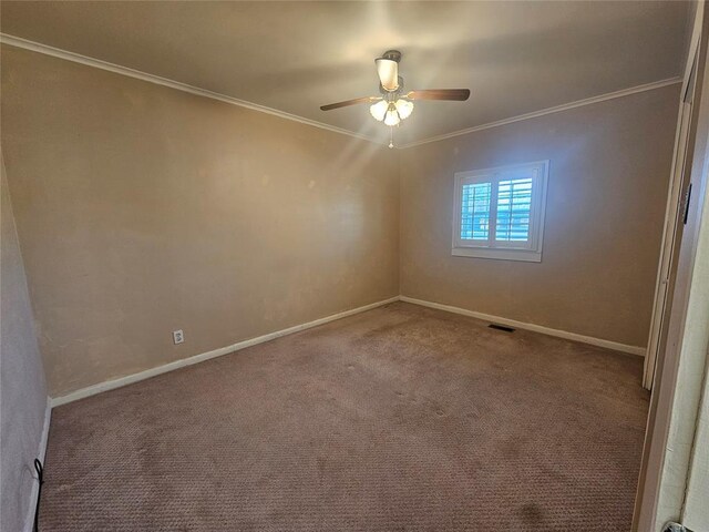 804 N Willow St, Pauls Valley, OK 73075 - empty room featuring crown molding, a ceiling fan, baseboards, visible vents, and carpet
