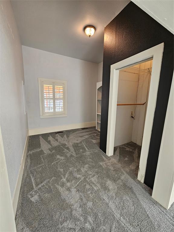 804 N Willow St, Pauls Valley, OK 73075 - unfurnished bedroom featuring a closet and carpet floors