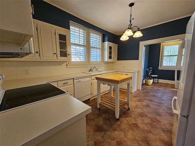 804 N Willow St, Pauls Valley, OK 73075 - kitchen featuring light countertops, a sink, glass insert cabinets, and white appliances