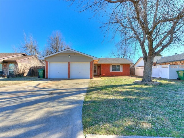 ranch-style home with brick siding, concrete driveway, a front yard, fence, and a garage