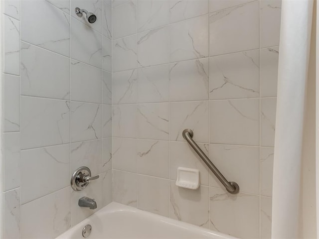 bathroom with shower / washtub combination