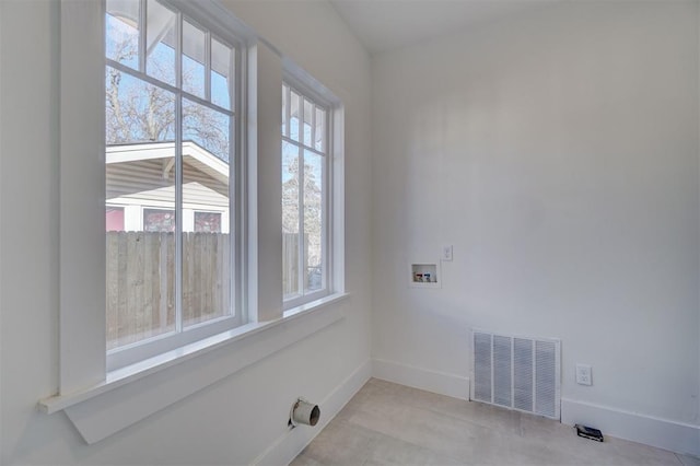 laundry room with laundry area, baseboards, hookup for a washing machine, and visible vents