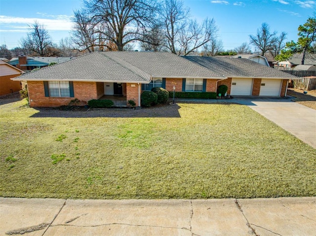 single story home featuring driveway, an attached garage, a shingled roof, and a front yard