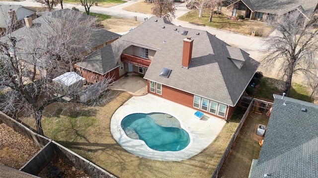 view of swimming pool with a fenced backyard and a patio