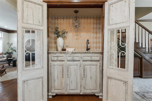 kitchen featuring hanging light fixtures and dark wood-style floors