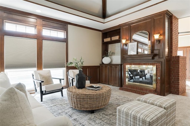 living area featuring built in features, light colored carpet, crown molding, and a multi sided fireplace