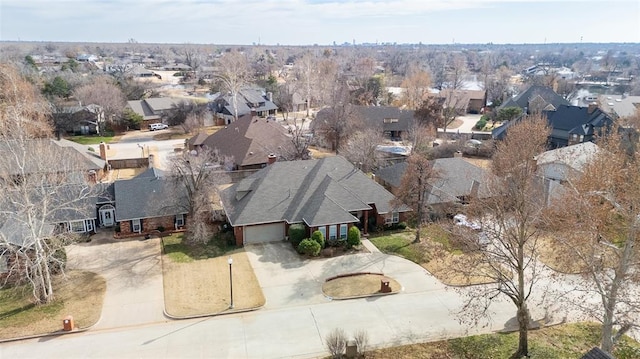 birds eye view of property with a residential view