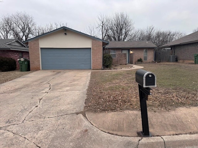 ranch-style house featuring brick siding, cooling unit, driveway, and a garage