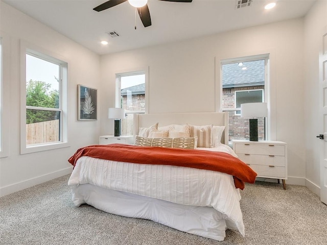 carpeted bedroom with baseboards, visible vents, and recessed lighting