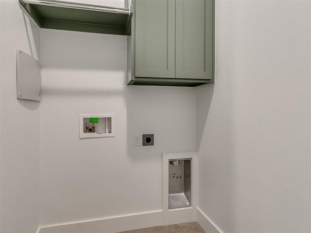 washroom with cabinet space, hookup for a washing machine, baseboards, and hookup for an electric dryer