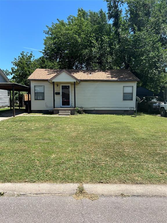 view of front of house featuring entry steps, an attached carport, crawl space, and a front yard