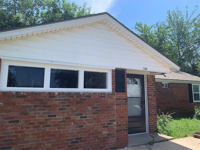 view of front of home featuring brick siding