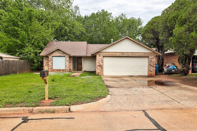 single story home featuring a garage, a front lawn, fence, brick siding, and concrete driveway