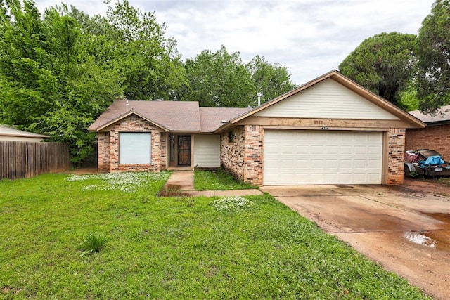 ranch-style home with brick siding, an attached garage, driveway, and a front yard