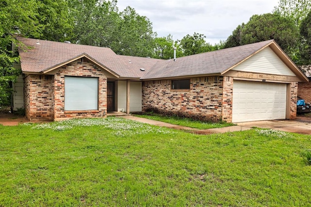 single story home featuring an attached garage, a front lawn, and brick siding