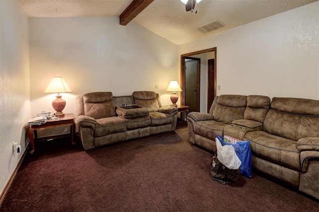 living area featuring ceiling fan, lofted ceiling with beams, dark colored carpet, and visible vents