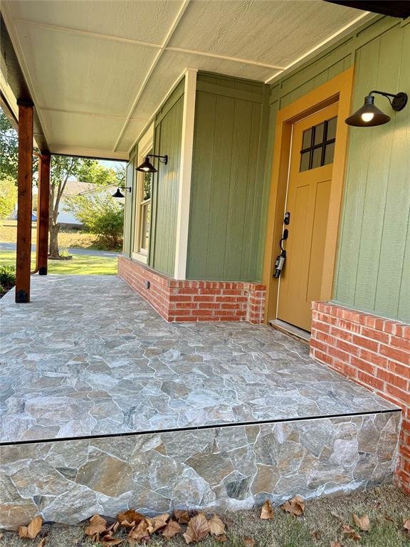 entrance to property with brick siding