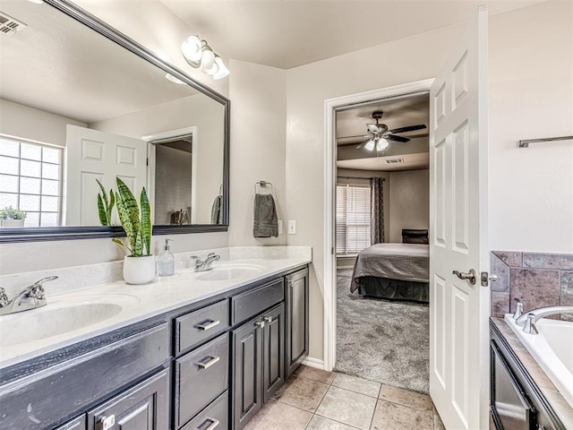 bathroom with connected bathroom, tile patterned flooring, a sink, and double vanity