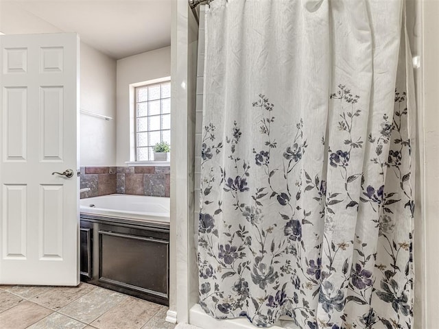 full bath with a stall shower, a bath, and tile patterned floors